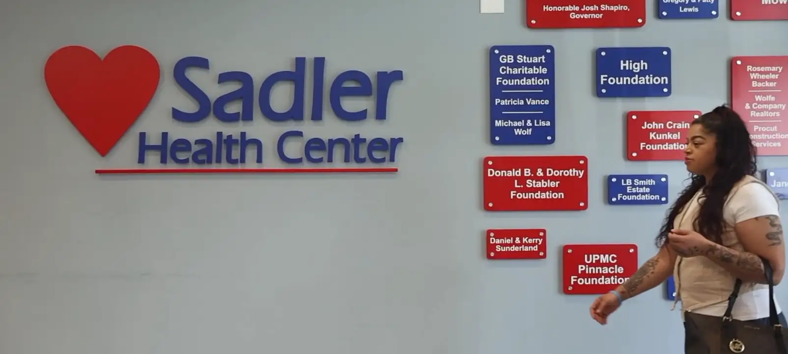 A patient walks into Sadler Health Center.